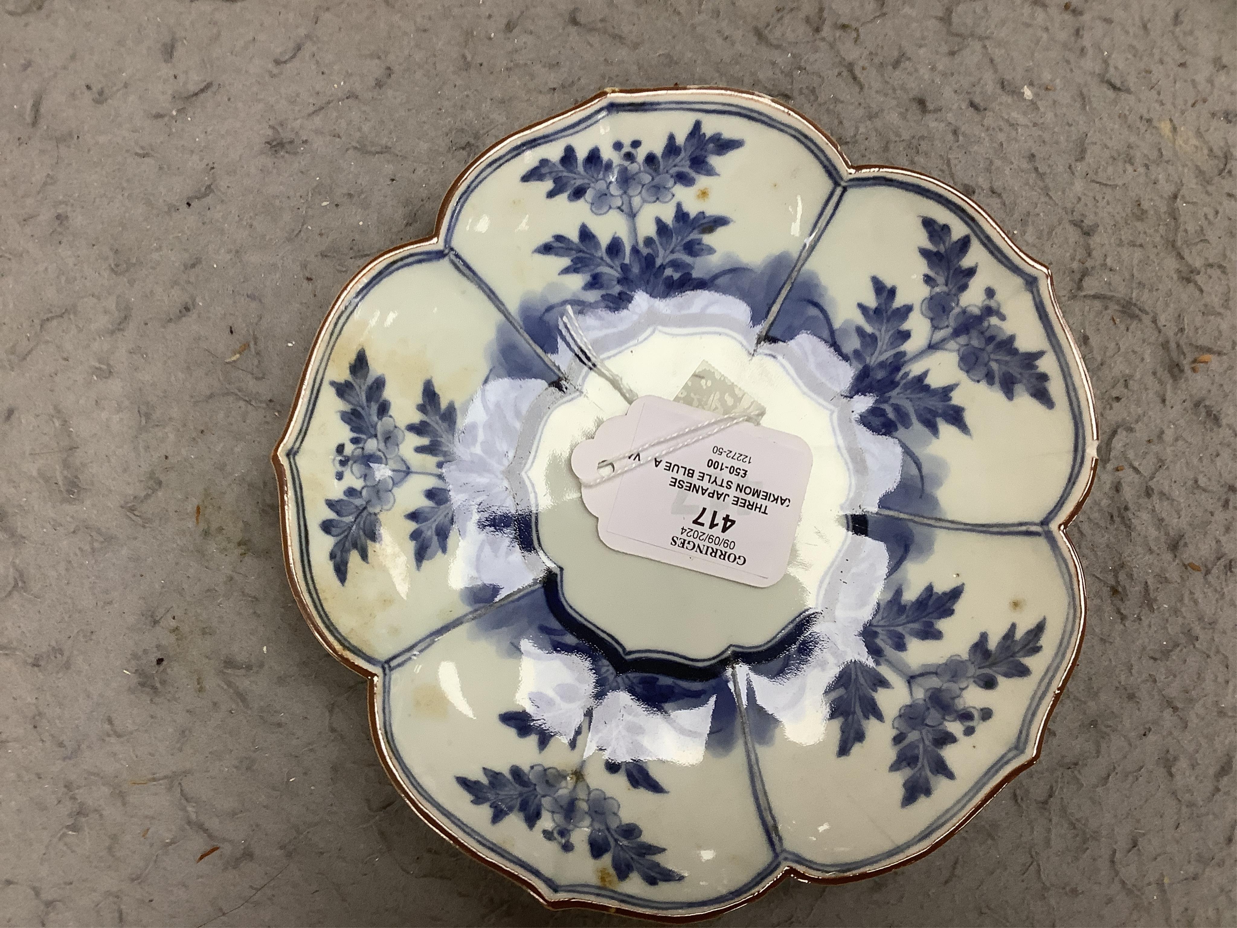 Three Japanese Kakiemon style blue and white dishes and an 18th century Chinese famille rose dish. Condition - varies